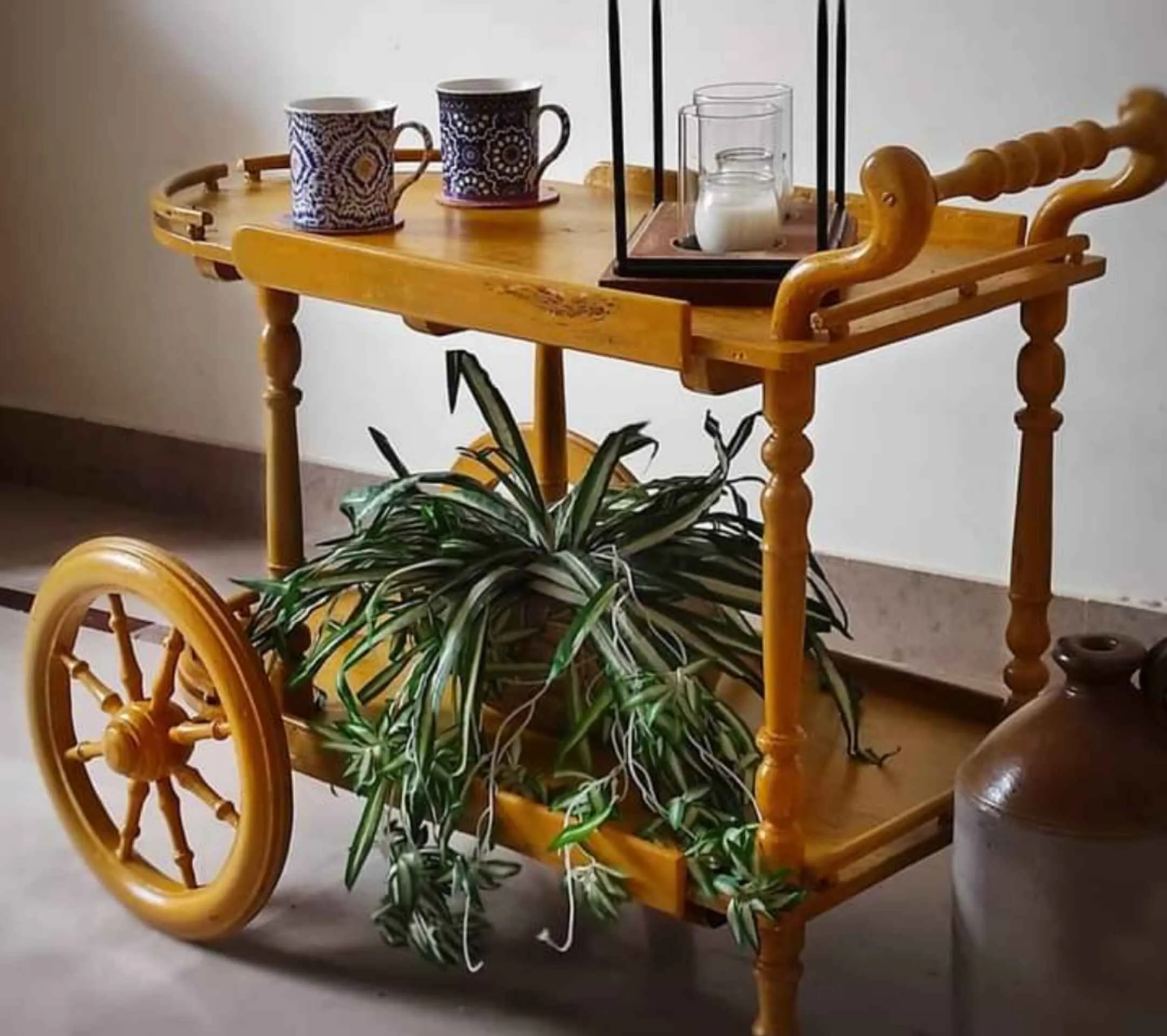 Walnut finish round tea trolley